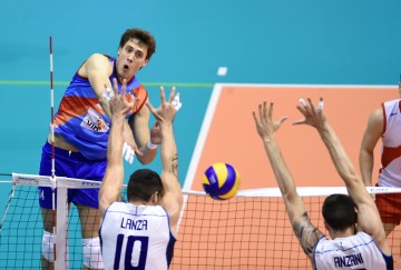 Serbian Aleksandar Atanasijevic spikes during match against Italy